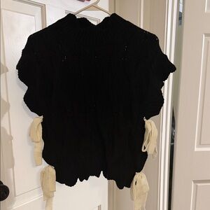 Elegant Black Turtleneck Sweater with Cream Ties